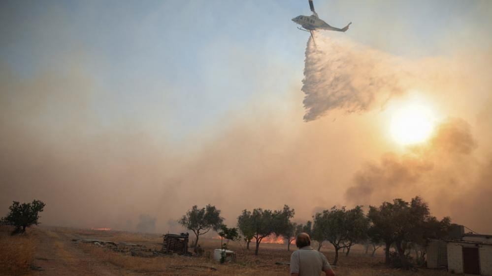 Helicopters fighting Greece wildfires collide mid‑air