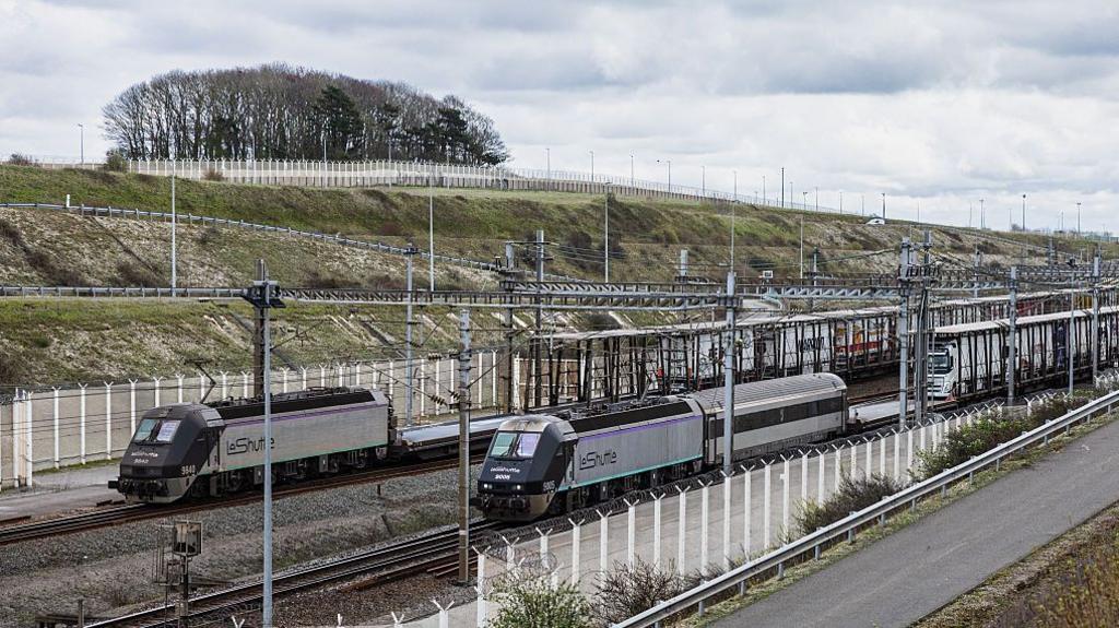 Bus Collides With Stationary Freight Train at Channel Tunnel Entrance, 19 Injured