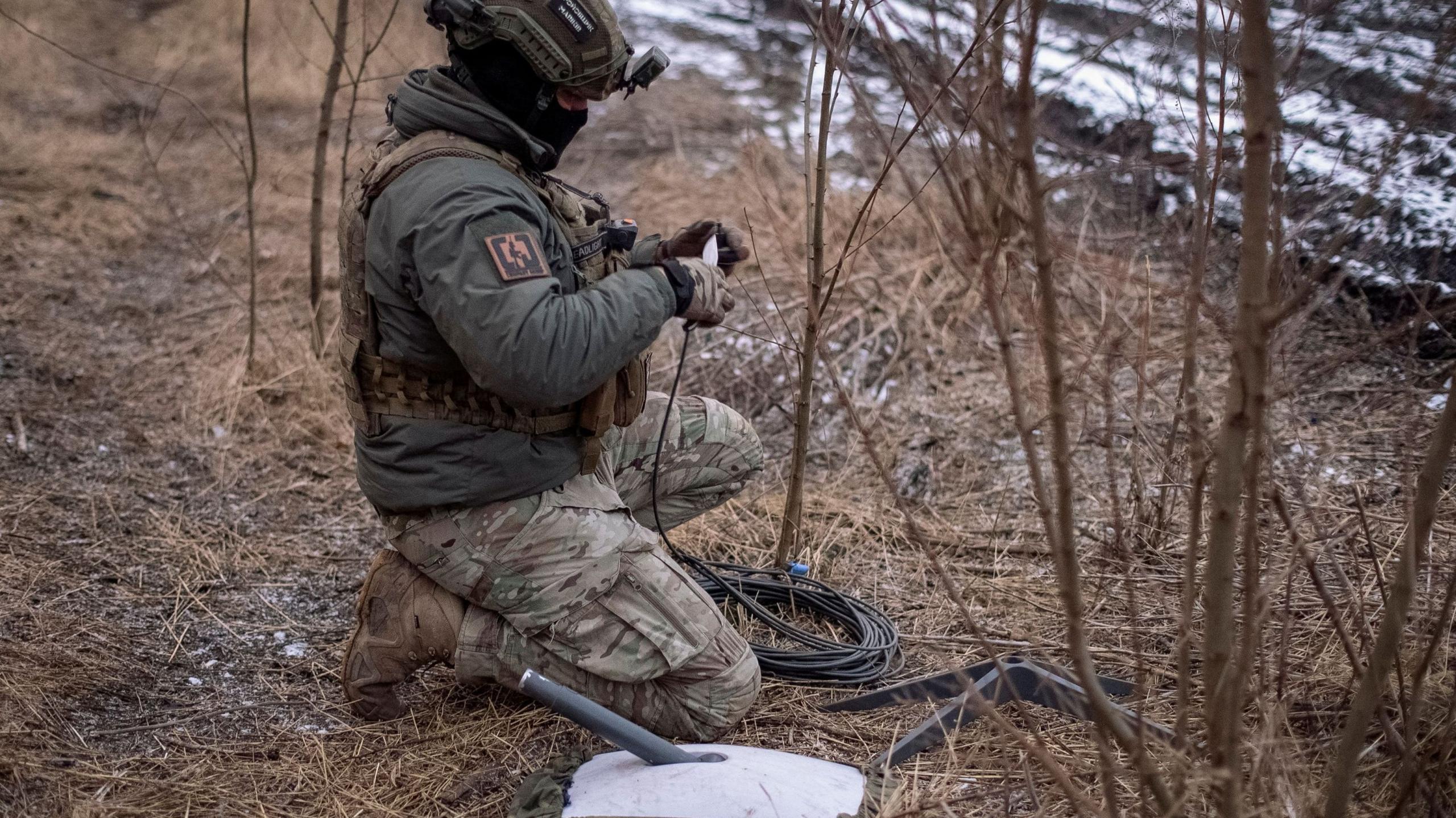 Ukrainian soldier using Starlink at the front line