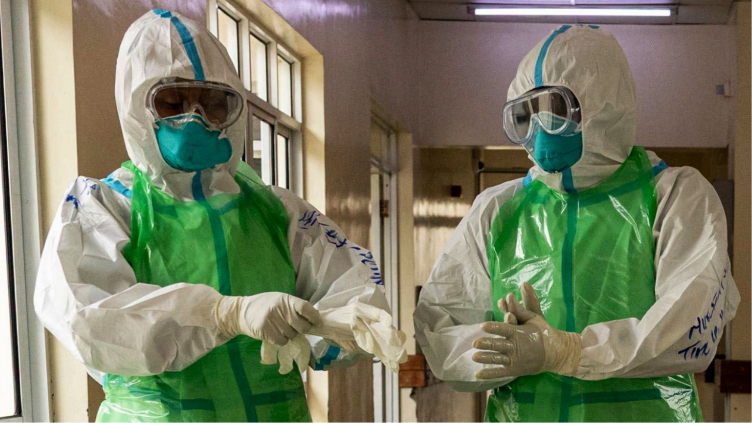 Nurses in PPE preparing for an Ebola patient