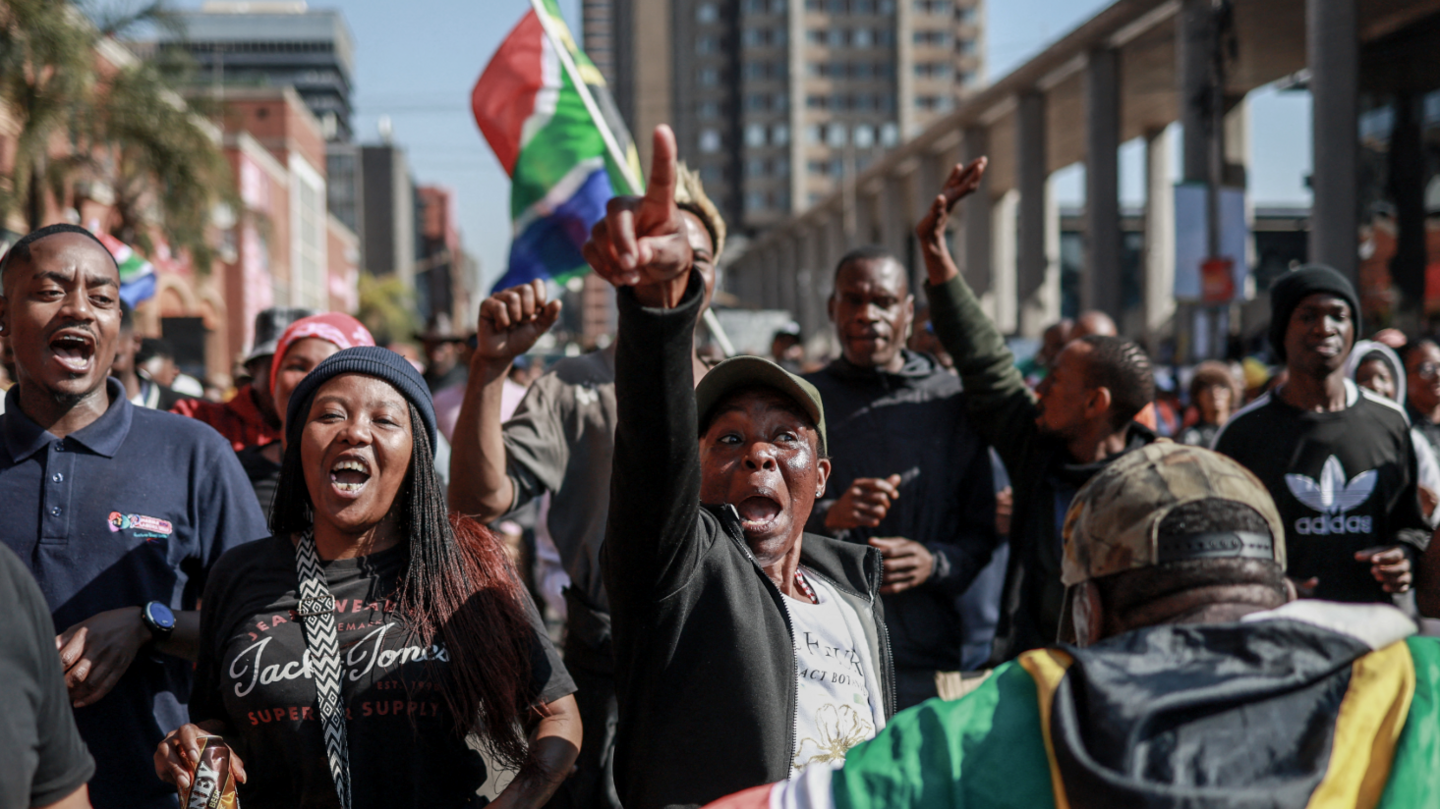 South Africa Faces Migrant Crisis: Thousands Protest for Expulsion Amid Heavy Police Presence