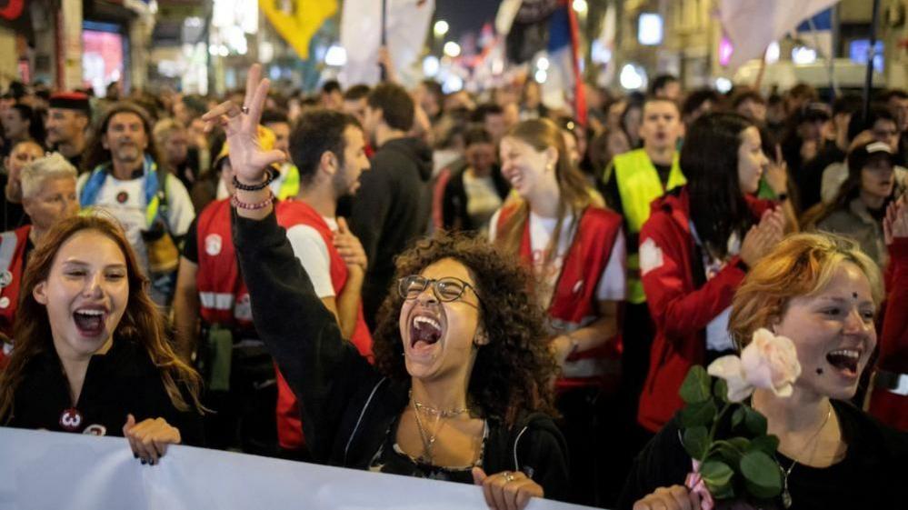 Students celebrate arrival in Belgrade for the final rally of the Student List campaign