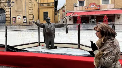 Pavarotti Statue Encased in Ice Rink Sparks Controversy in Italy