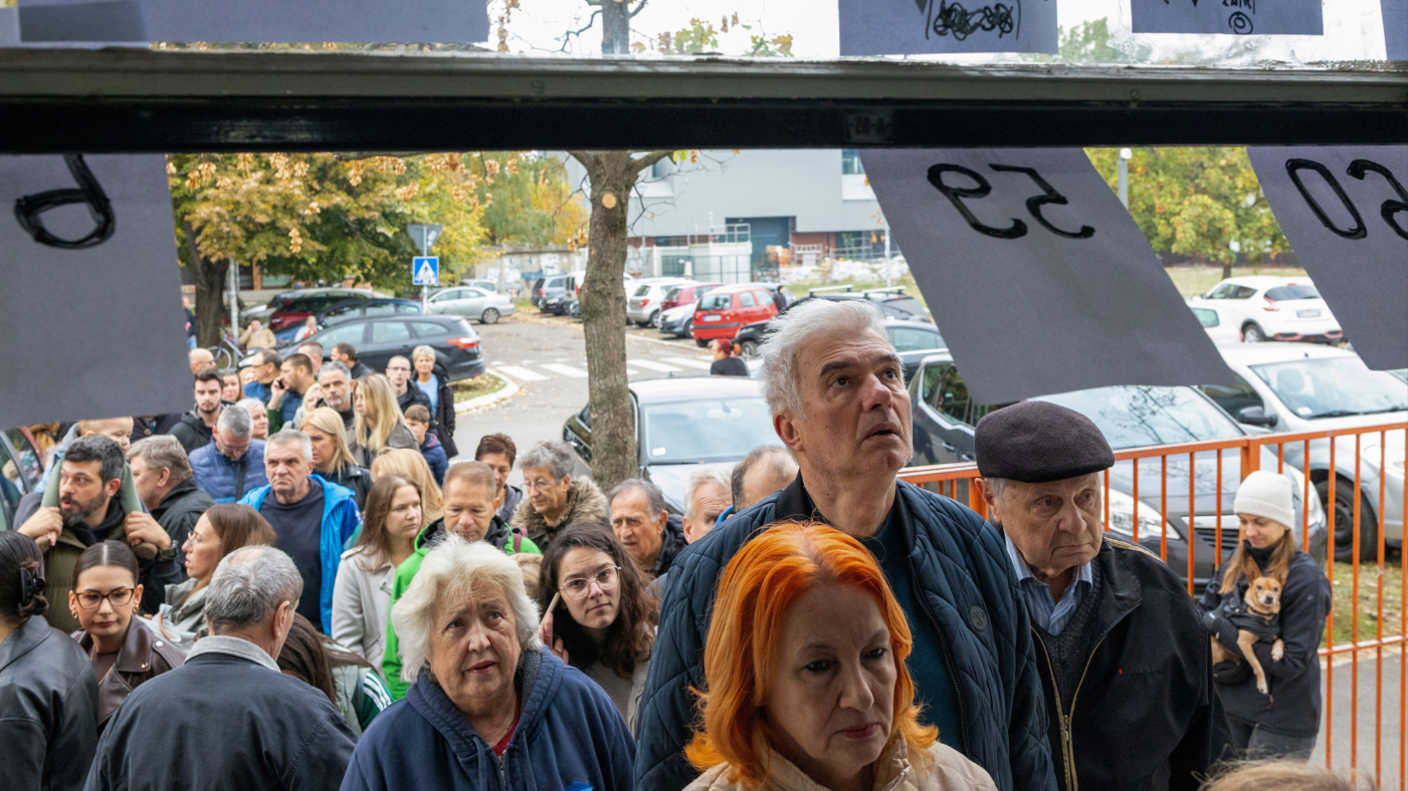 People queue outside a polling station in Novi Sad during Serbia’s parliamentary election