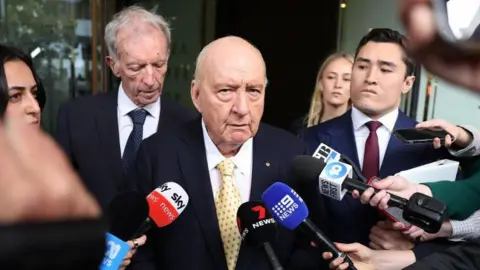 Sex Abuse Charges Against Alan Jones Reduced: Veteran Australian Broadcaster Faces 27 Counts